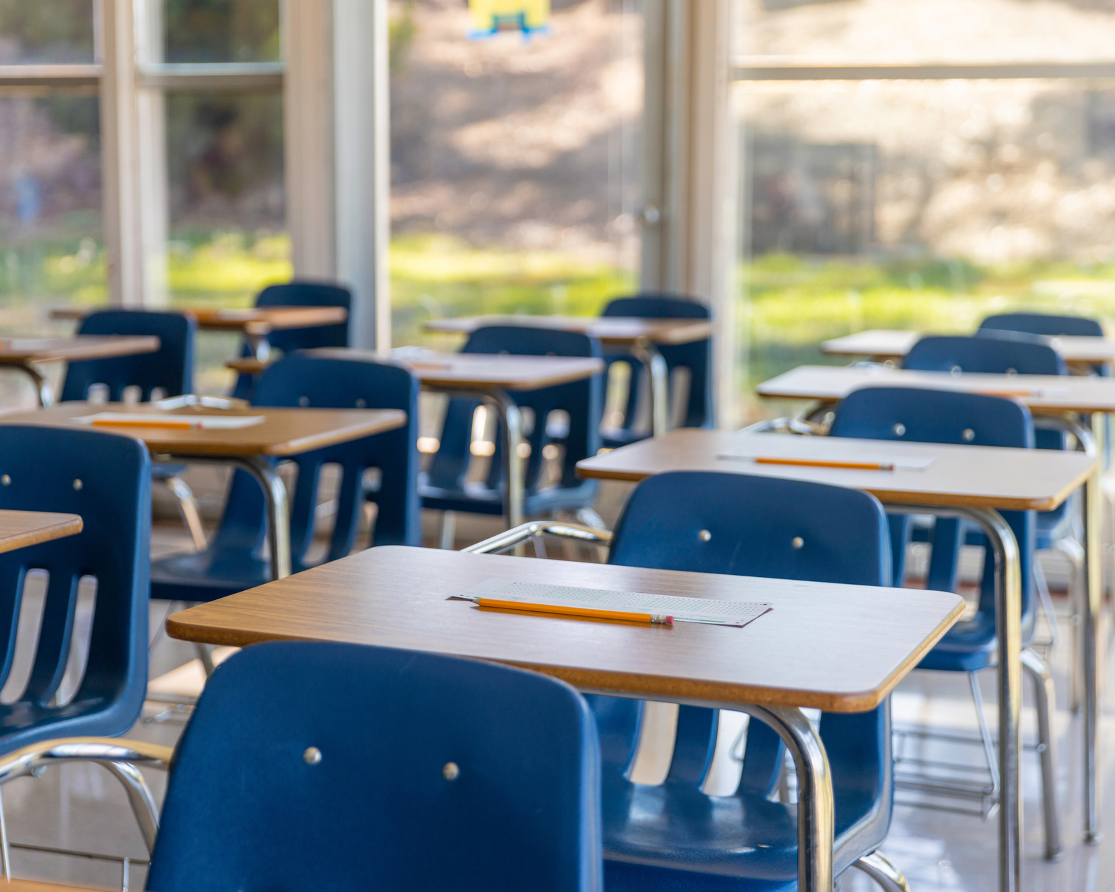 Empty classroom desks — a visual reminder of enrollment challenges