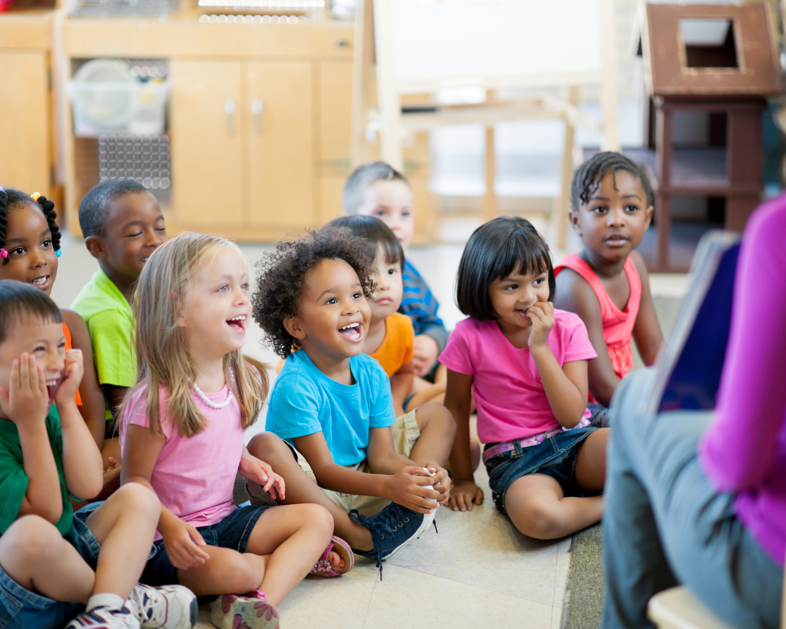 Young students engaged and laughing in a classroom